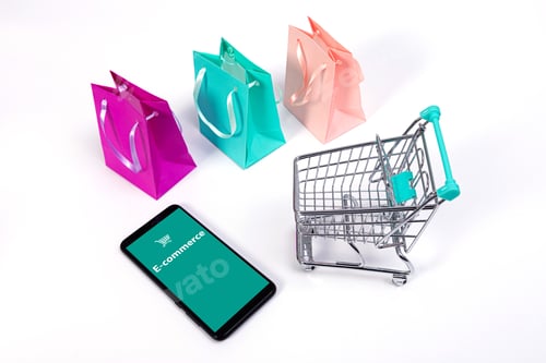 Preview: smartphone, mini shopping cart with credit cards and colourful paper bags isolated on white