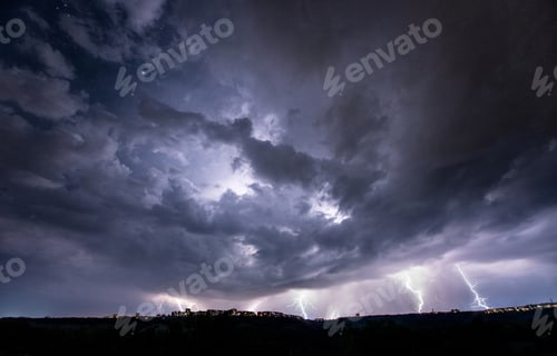 Preview: Beautiful thunderstorm with clouds and lightning over the night city