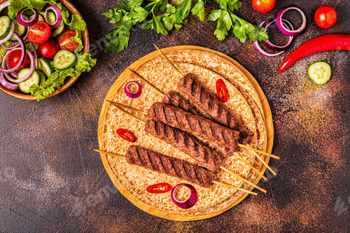 Preview: Traditional middle eastern, arabic or mediterranean meat kebab with vegetables and lavash bread.