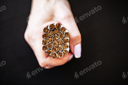 Preview: Stop smoking concept on background with broken cigarettes. Heap of cigarettes. No smoking.
