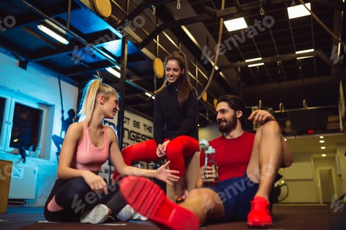 Preview: Group of friends relaxing after the training. Friends having conversation after exercising.