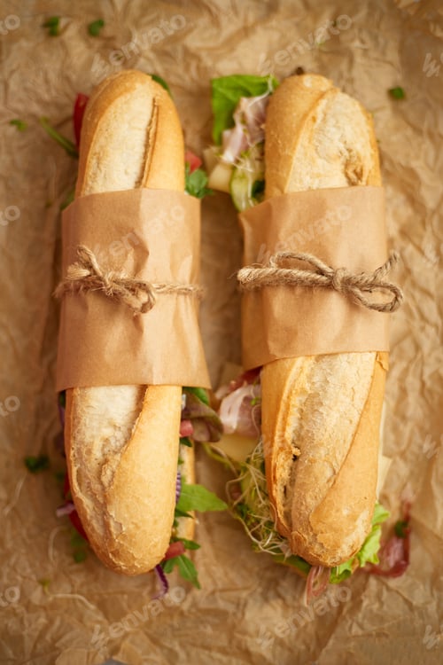 Preview: Tasty homemade sandwiches Baguettes with various healthy ingredients. Breakfast take away concept