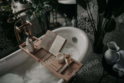 Preview: Luxurious interior bathroom in modern eco style with oval bathtub and book on bamboo wood tray