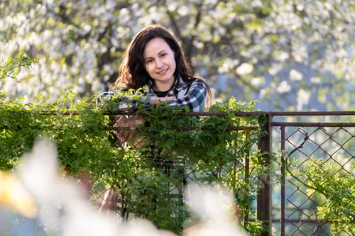 Preview: Portrait of pretty young woman relaxing outdoors on warm spring sunny day.