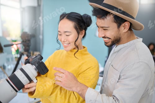 Preview: Creative, photography and photographer talking to a model while looking at pictures on a camera. Di