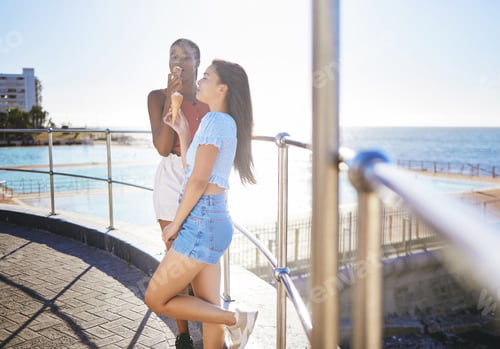 Preview: Girl friends have ice cream while out in the sun, on summer vacation at the pool and the ocean in t