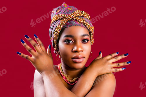 Preview: zanzibar african woman in turban and make up with blue nails
