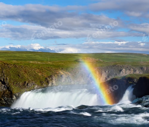 Preview: Summer landscape with a waterfall and rainbow in Iceland