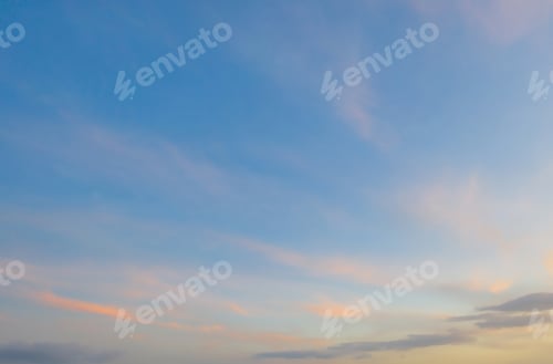 Preview: Sunset sky. Abstract nature background. Dramatic blue and orange, colorful clouds at twilight time.