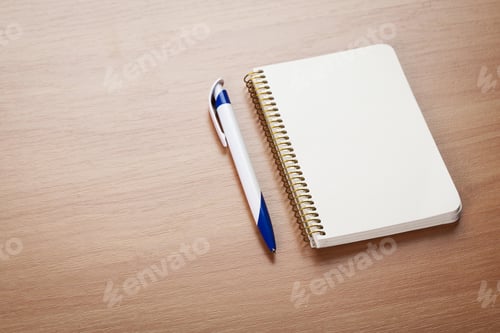 Preview: Blank note paper with pen on wood background
