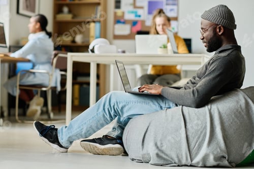 Preview: Man working on laptop in office