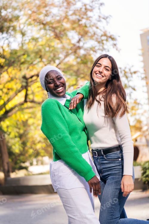 Preview: multiracial couple of two young women having fun
