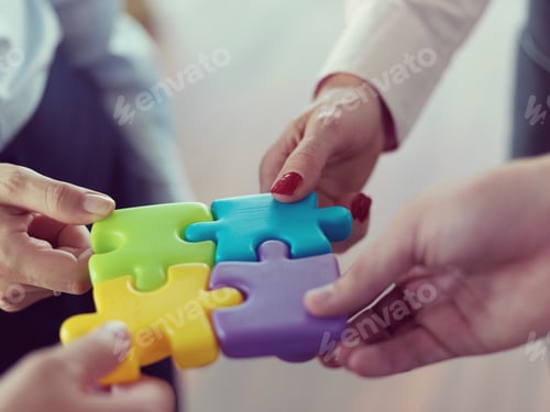 Preview: business people group assembling jigsaw puzzle