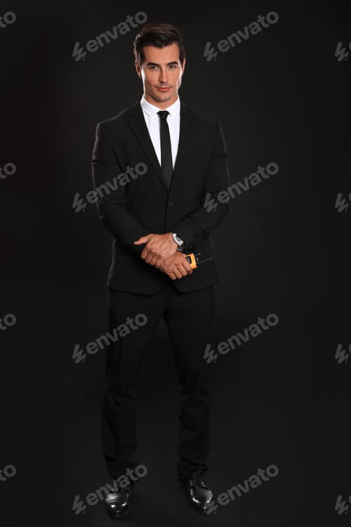 Preview: Male security guard in uniform on dark background