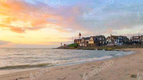 Preview: Urk Flevoland Netherlands sunset at the lighthouse and harbor of Urk Holland. Fishing village Urk
