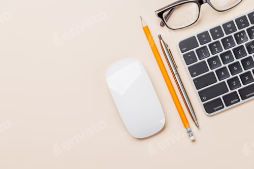 Preview: Office supplies on beige desk