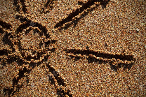 Preview: The Sun On The Sand In The Summer Is Lined With Stones