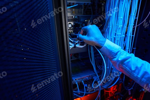 Preview: Person inserting twisted pair with connector to server rack port