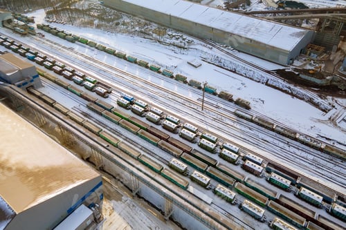 Preview: Aerial view of cargo train loaded with crushed sandstone materials at mine factory. Railway