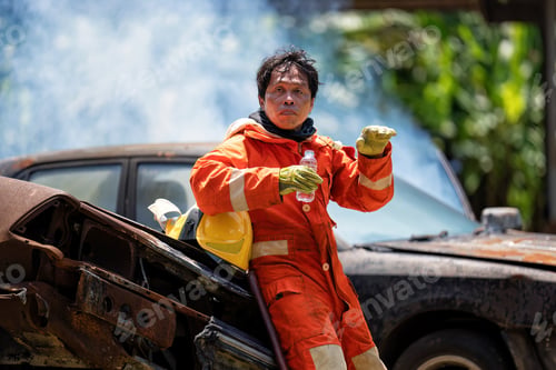 Preview: Fireman wearing fire protection suite and oxygen tank rest relax drink water after exercise