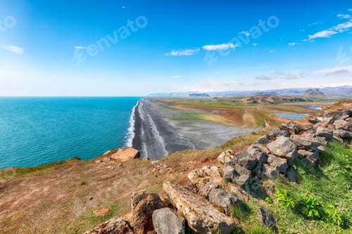 Preview: Fantasic view of Kirkjufjara black sand beach from Dyrholaey promontory on Atlantic South Coast.