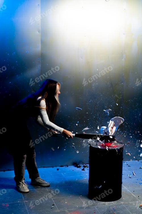 Preview: artist girl smashes a sculpture with a baseball bat protest art performance stress relief
