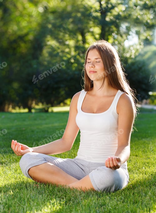 Preview: Attractive young woman doing yoga