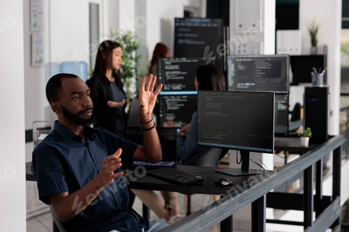 Preview: Software developer checking source code using ar hologram