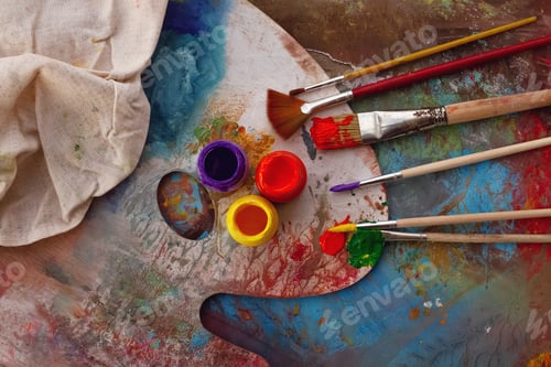 Preview: palette with paints and brushes for painting