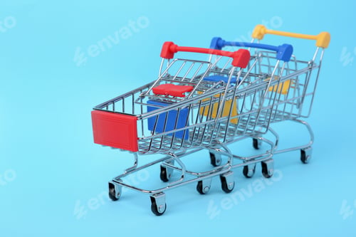 Preview: Empty shopping trolleys on color background. Space for text