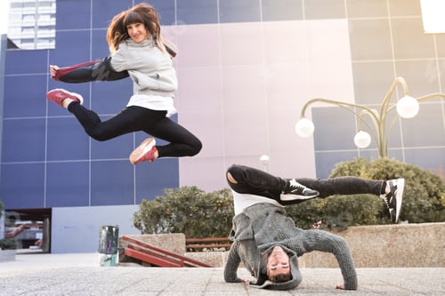 Preview: Young happy couple dancing on the street