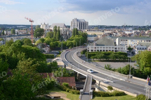 Preview: Aerial shot of a highway taking into a city on the background at daytime