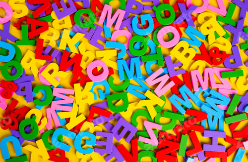 Preview: Top view colorful letters on yellow background. Education Concept