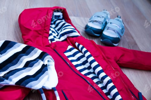 Preview: baby winter clothing, concept, autumn, sneakers, caps, toys. how to dress baby in winter.
