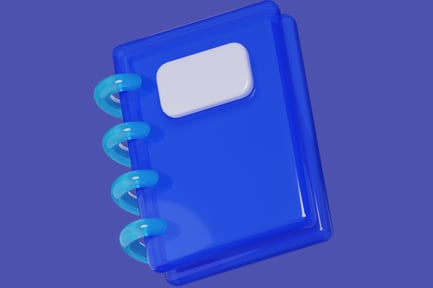 Preview: Blue notebook with white label on purple background.