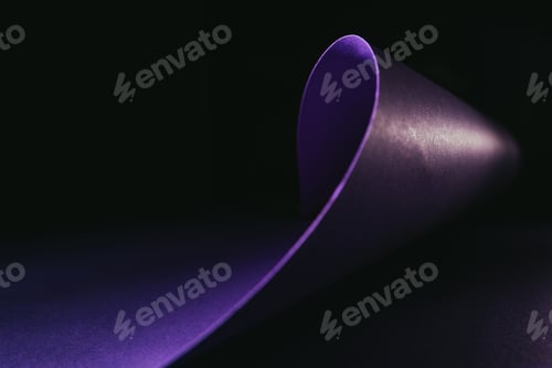Preview: warping purple paper in shape of wave on black