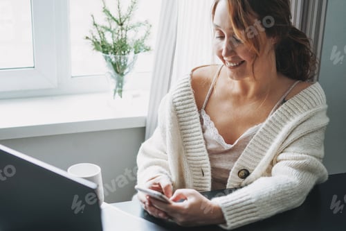 Preview: Woman Using Mobile Phone at Desk Indoors