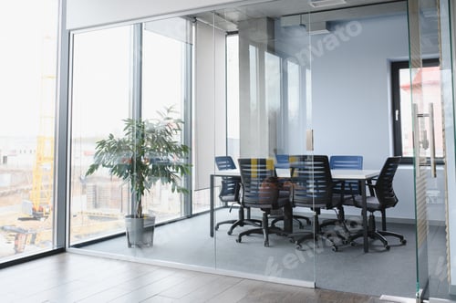 Preview: Modern office meeting room with glass walls and construction view