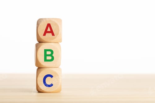 Preview: ABC letters alphabet in wooden blocks stacked on wood table