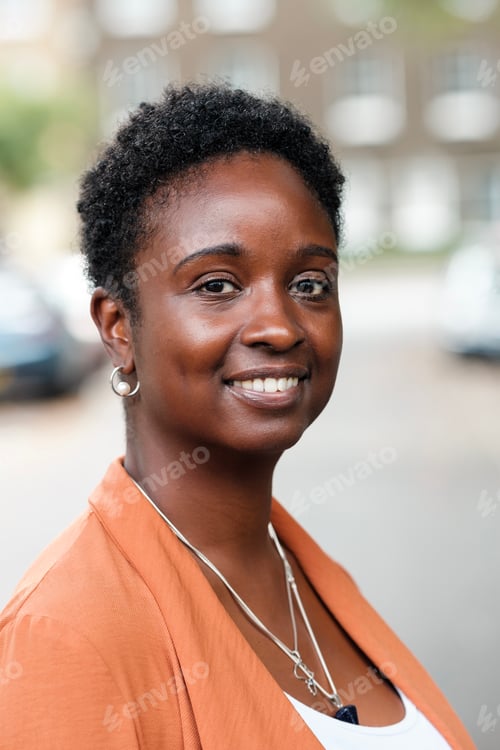 Preview: Head-shot of curly black woman.