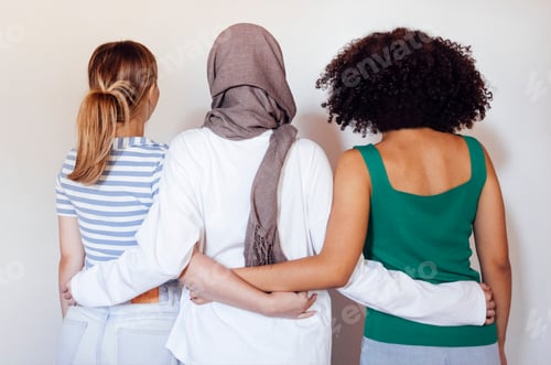 Preview: Strong female friendship. Rear view ttree teen girls best friends holding hands