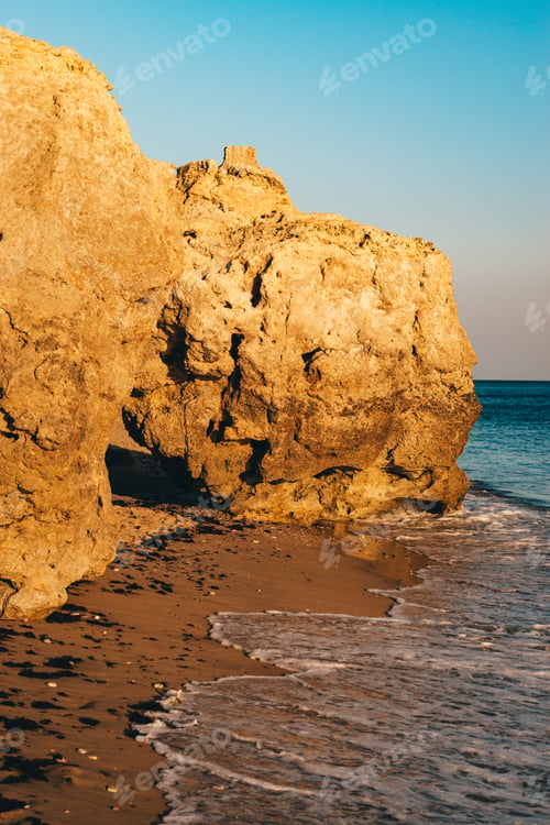 Preview: Sunlit Rocky Cliffs by the Sea