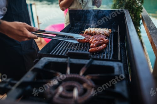 Preview: Couple barbecuing outdoors