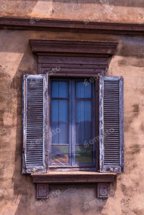 Preview: Large, open window is situated on the side of an urban building