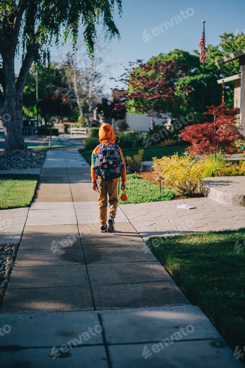 Preview: A boy in colourful clothes and colorful backpack with the planets is going to school in the morning