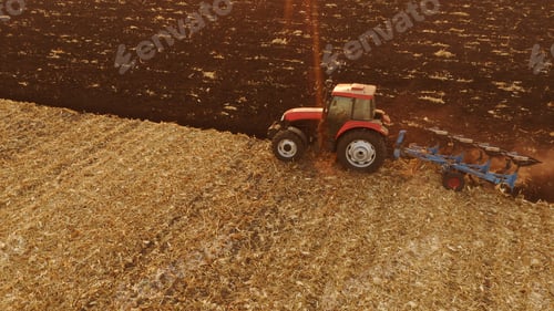 Preview: Agricultural background with tractor working on field.