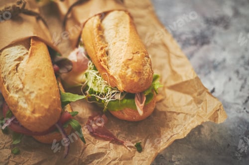 Preview: Tasty homemade sandwiches Baguettes with various healthy ingredients. Breakfast take away concept