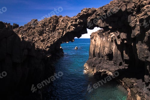 Preview: Stunning natural rocky arch above ocean