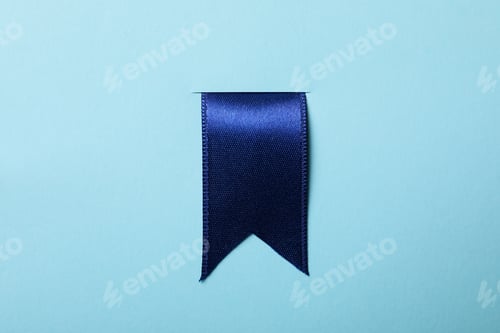 Preview: Blue satin ribbon on blue background, close up