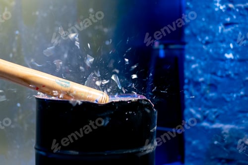 Preview: close up of a baseball bat smashing a glass in a destroy room for stress relief glass flies